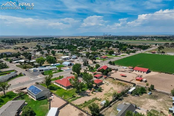 an aerial view of a houses with outdoor space