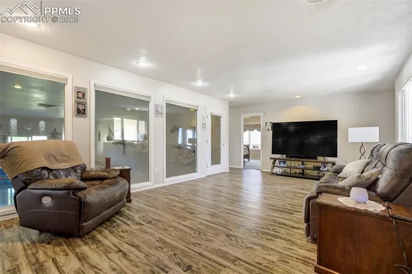 a living room with furniture and a flat screen tv