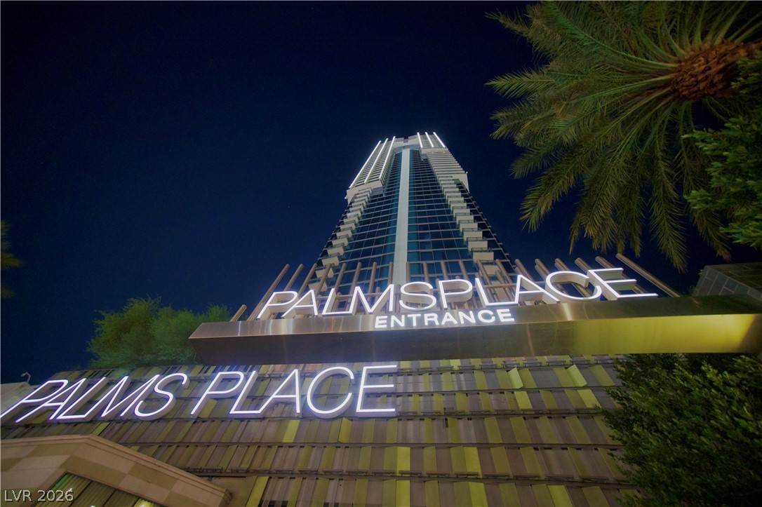 4381 West Flamingo Road, Unit 3616 Las Vegas, NV 89103 - Photo 24 of 29 Experience modern architectural design in this high-rise building with a grand illuminated entrance.