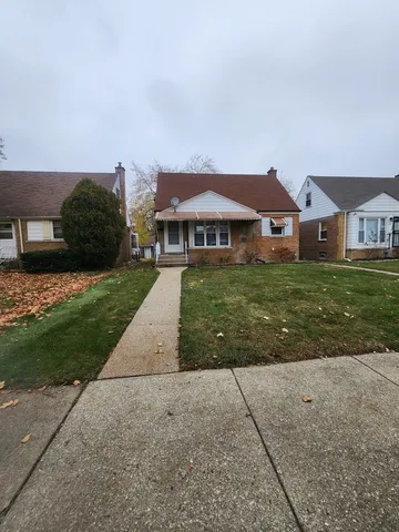 a front view of a house with yard