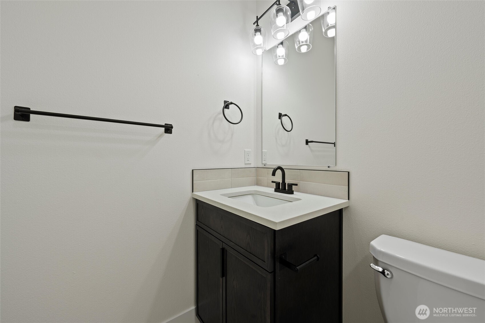 701 O Street Southwest Quincy, WA 98848 - Photo 12 of 33 a bathroom with a sink a toilet a mirror and shower