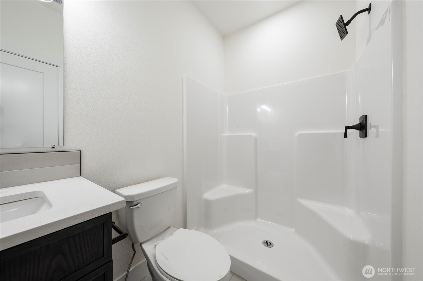701 O Street Southwest Quincy, WA 98848 - Photo 13 of 33 a white toilet sitting next to a bath tub