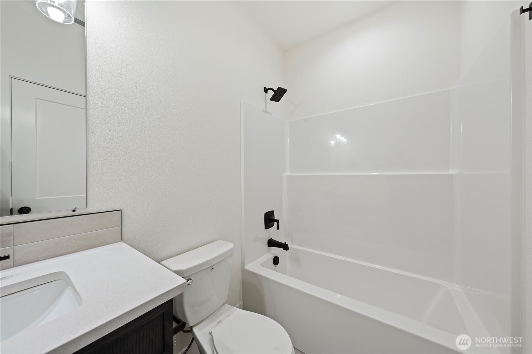 701 O Street Southwest Quincy, WA 98848 - Photo 9 of 33 a white toilet sitting next to a bath tub