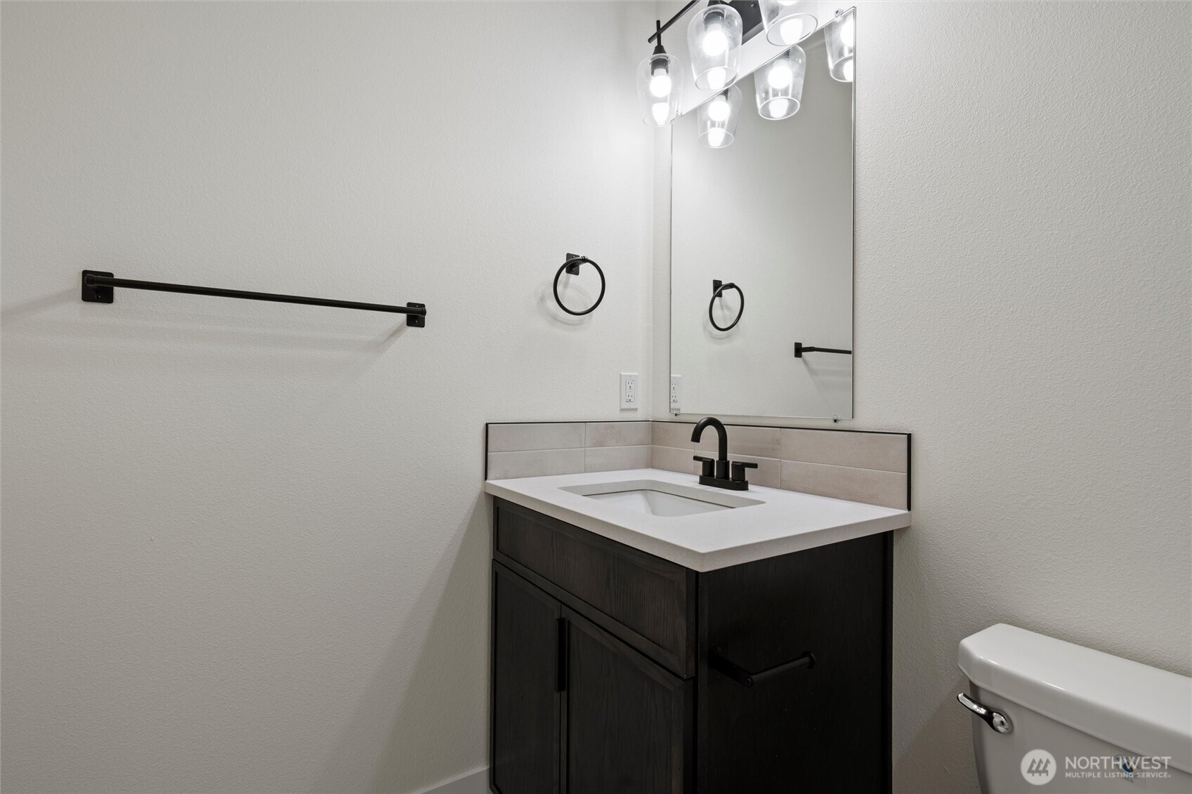 701 O Street Southwest Quincy, WA 98848 - Photo 10 of 33 a bathroom with a sink a toilet and mirror