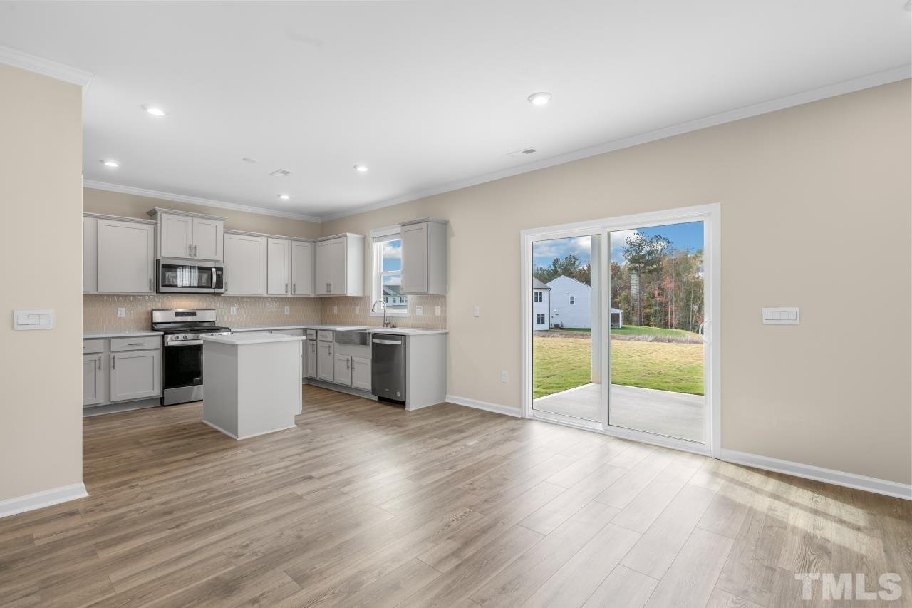 47 Madden Rose Loop Garner, NC 27529 - Photo 11 of 31 a view of kitchen with granite countertop refrigerator oven and cabinets