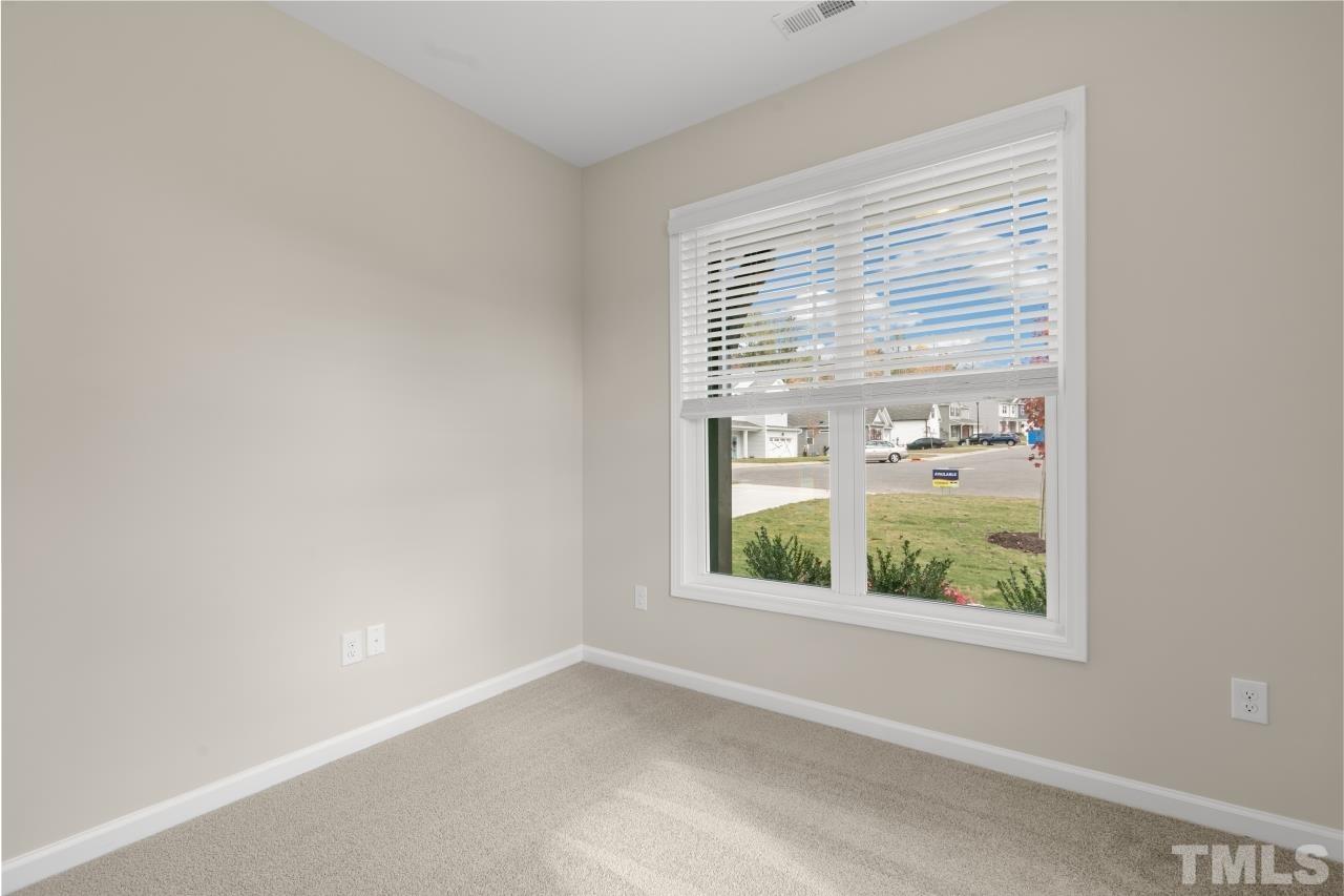 47 Madden Rose Loop Garner, NC 27529 - Photo 17 of 31 an empty room with a window