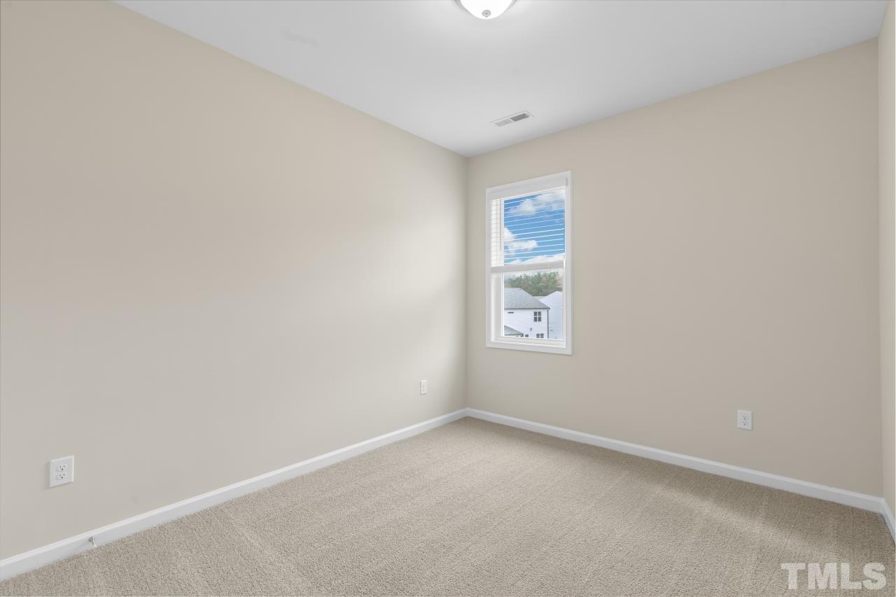 47 Madden Rose Loop Garner, NC 27529 - Photo 27 of 31 an empty room with a window