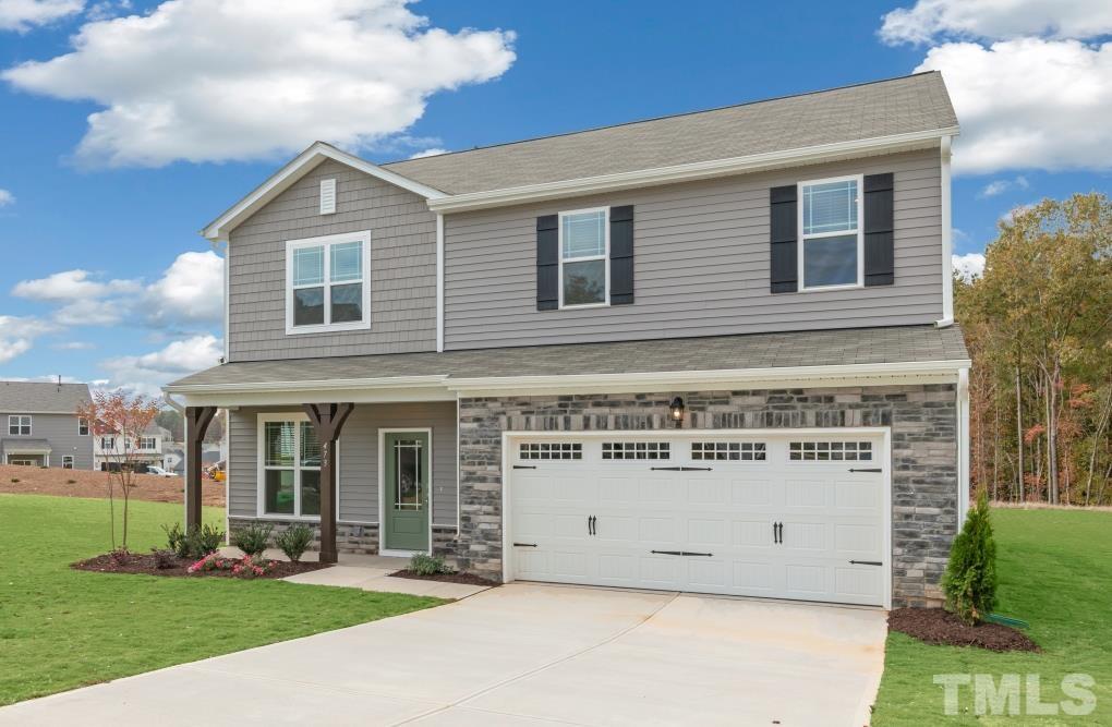 47 Madden Rose Loop Garner, NC 27529 - Photo 5 of 31 a view of a house with a yard