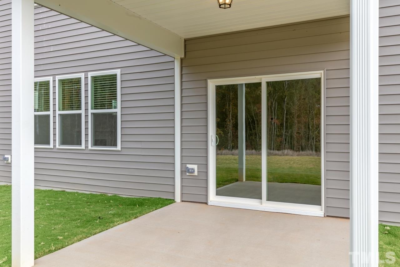 47 Madden Rose Loop Garner, NC 27529 - Photo 7 of 31 a view of a house with a backyard