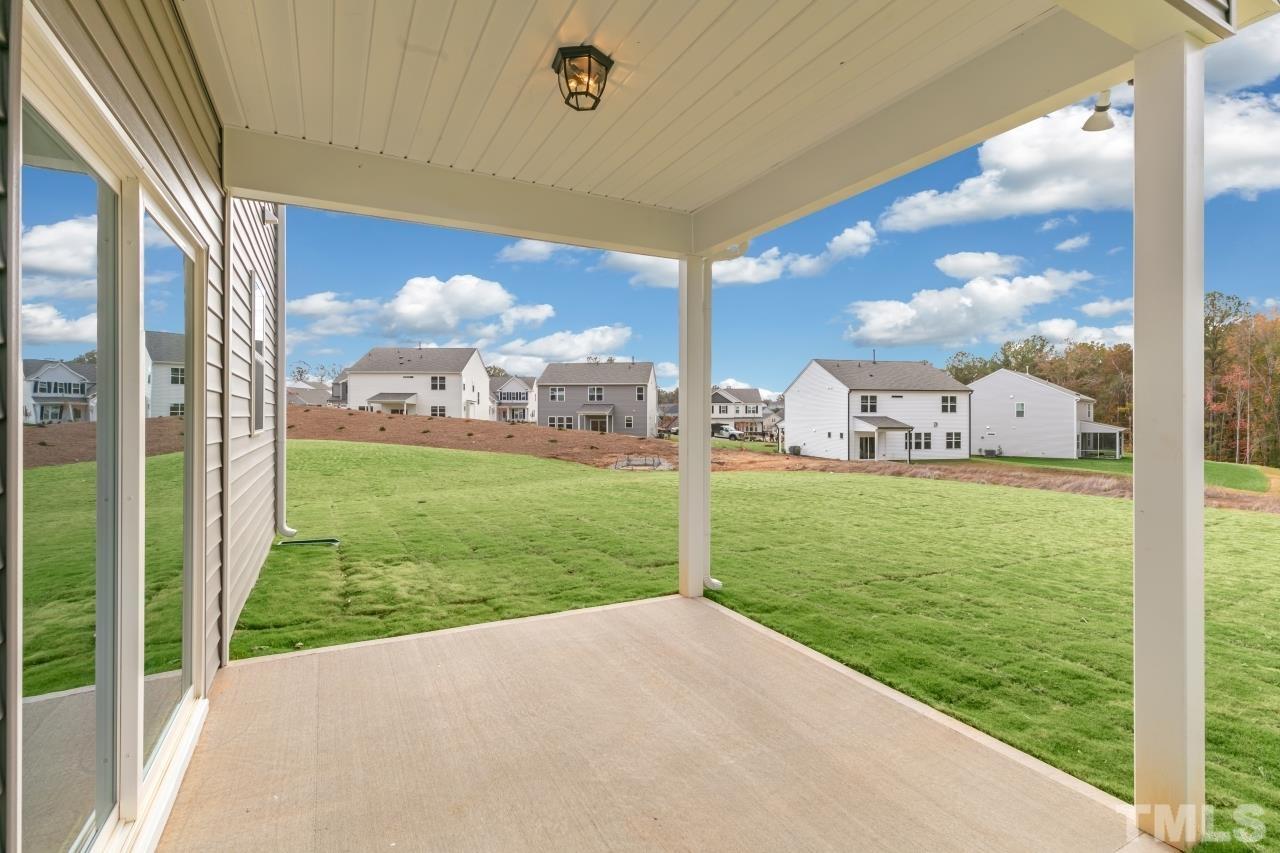 47 Madden Rose Loop Garner, NC 27529 - Photo 8 of 31 a view of a back yard of the house