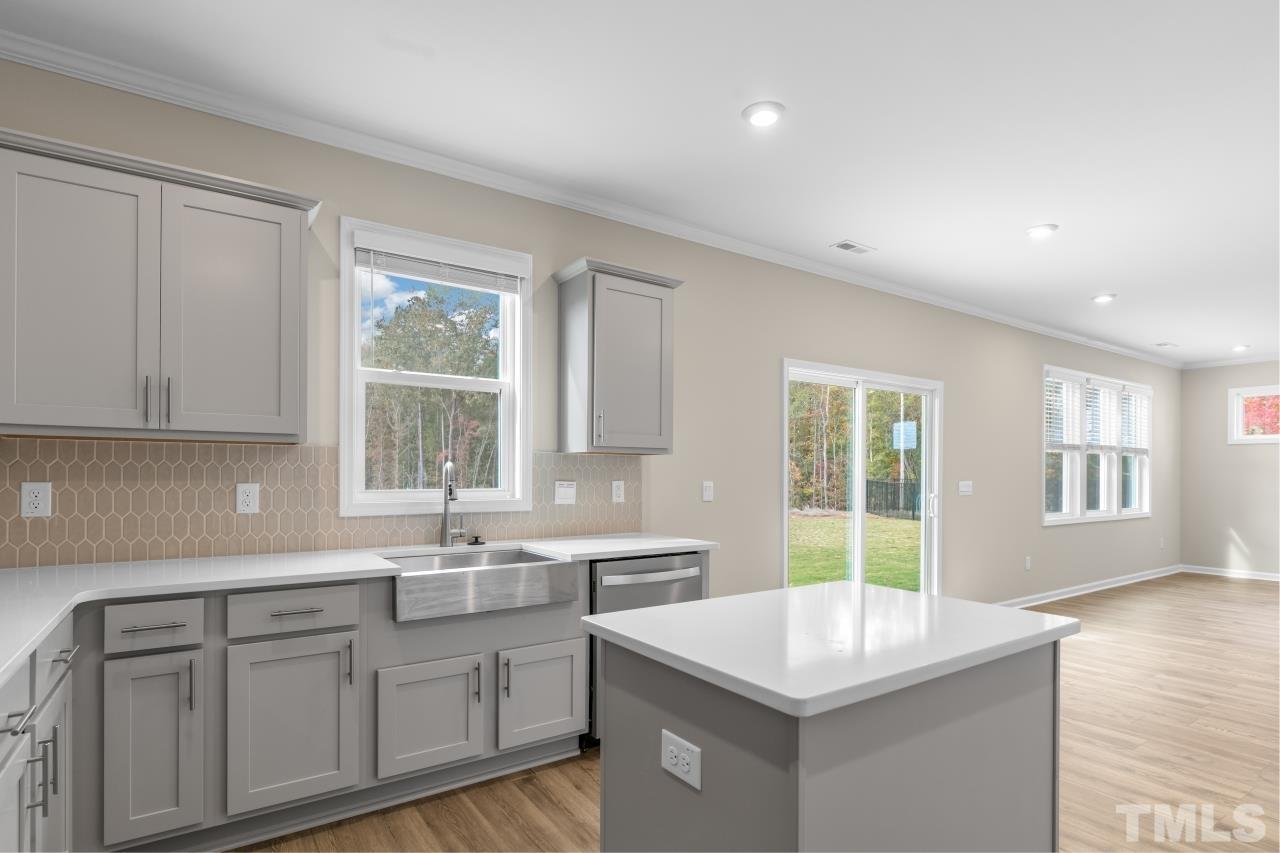 47 Madden Rose Loop Garner, NC 27529 - Photo 10 of 31 a kitchen that has a sink and a stove in it