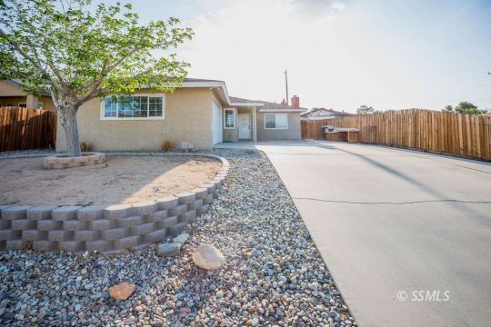 1233 South Ranger Street Ridgecrest, CA 93555 - Photo 5 of 30 a view of a house with a backyard