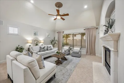 a living room with furniture and a fireplace