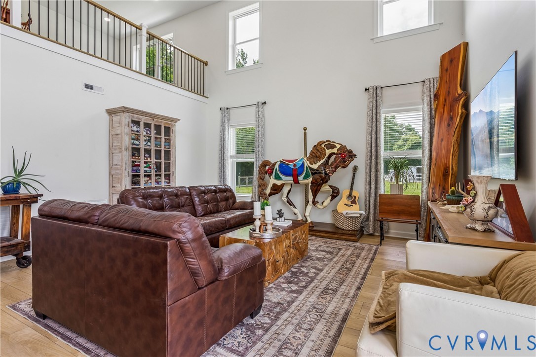 2016 Forge Road Toano, VA 23168 - Photo 49 of 99 Living area with soaring ceilings and abundant nat