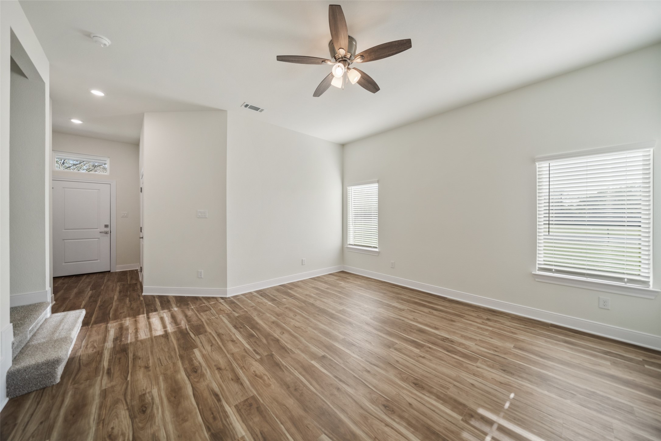 412 West Marlin Street Willis, TX 77378 - Photo 5 of 22 an empty room with wooden floor and windows