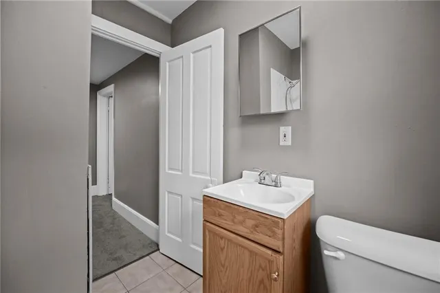a bathroom with a sink toilet and vanity