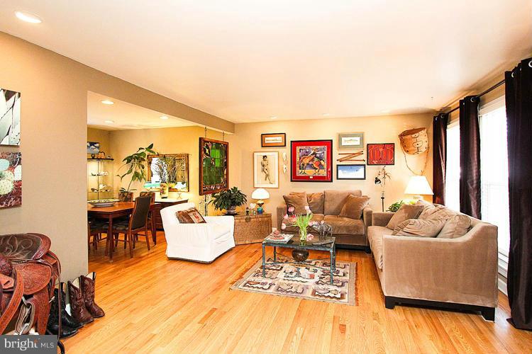2104 Thomas View Road Reston, VA 20191 - Photo 5 of 29 a living room with furniture wooden floor and a large window