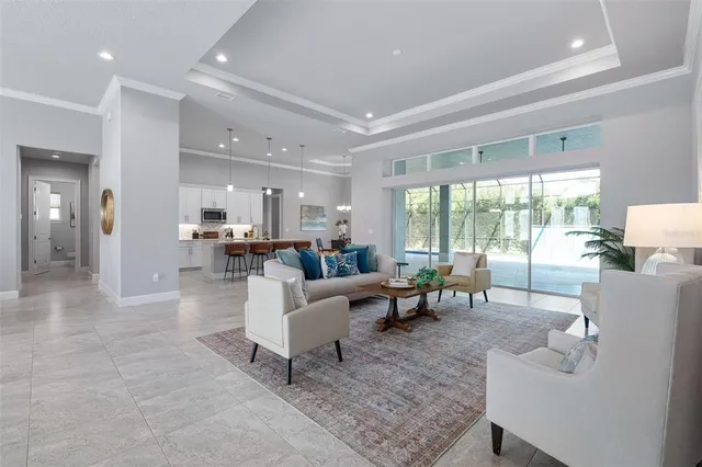 a kitchen with stainless steel appliances kitchen island granite countertop a refrigerator and cabinets