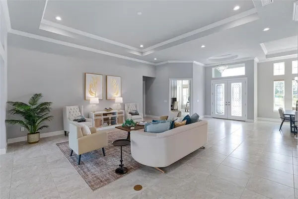 a kitchen with stainless steel appliances granite countertop a stove a sink a microwave a dining table and chairs