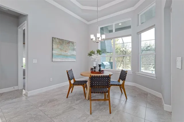 a spacious bedroom with a bed and glass windows