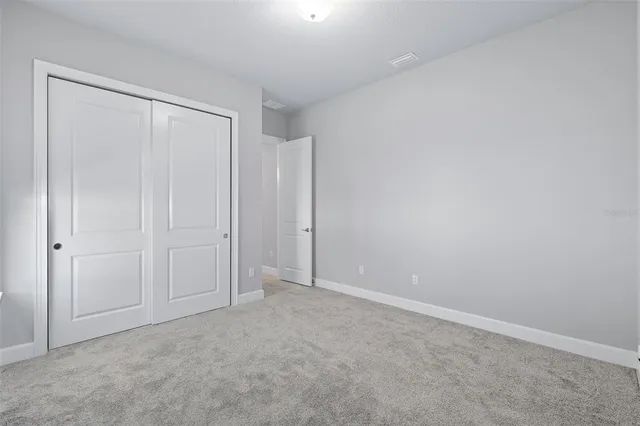 an aerial view of a house with a swimming pool yard and outdoor seating