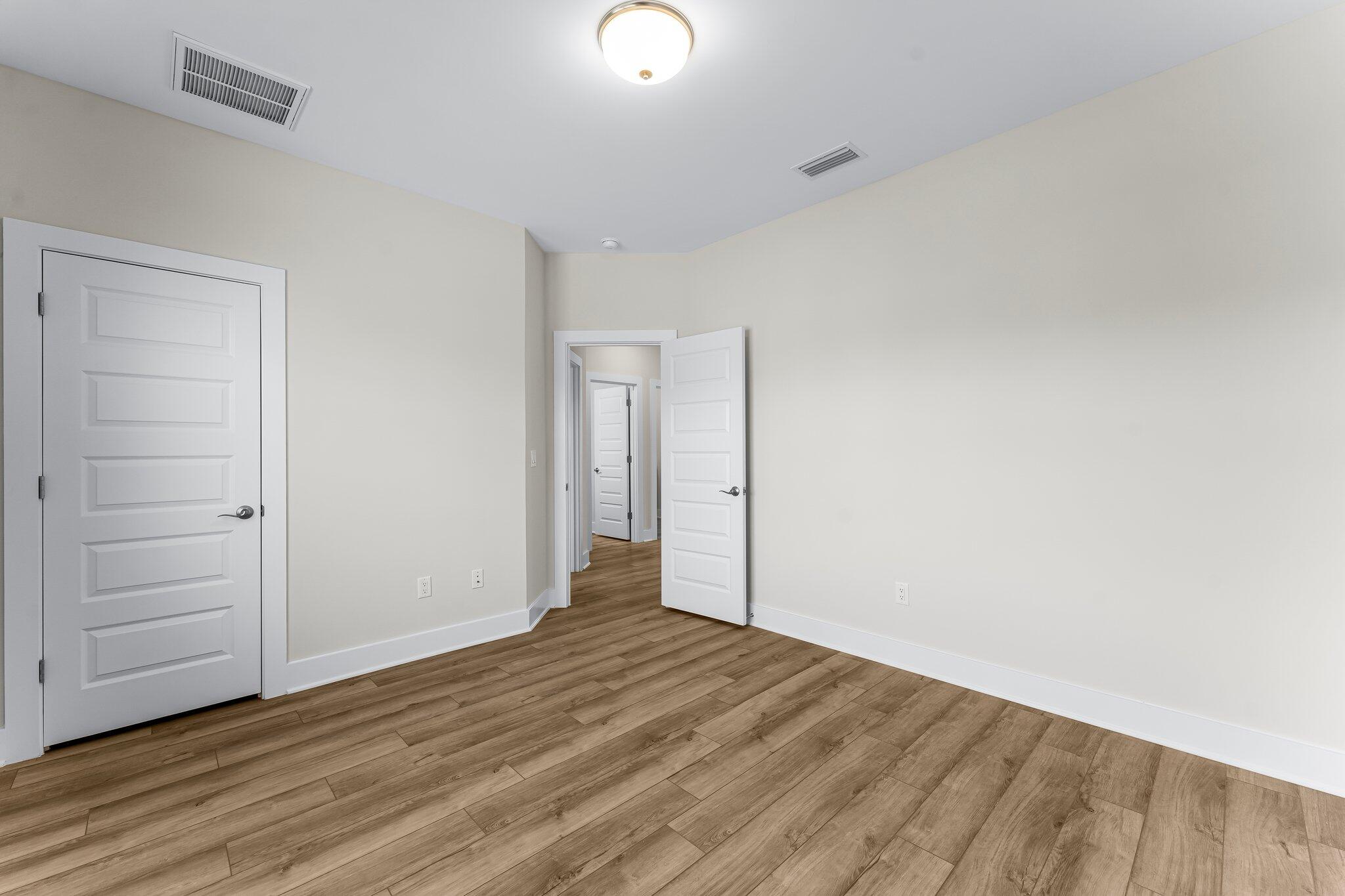 11 Tyler James Way Santa Rosa Beach, FL 32459 - Photo 31 of 56 a view of an empty room with wooden floor