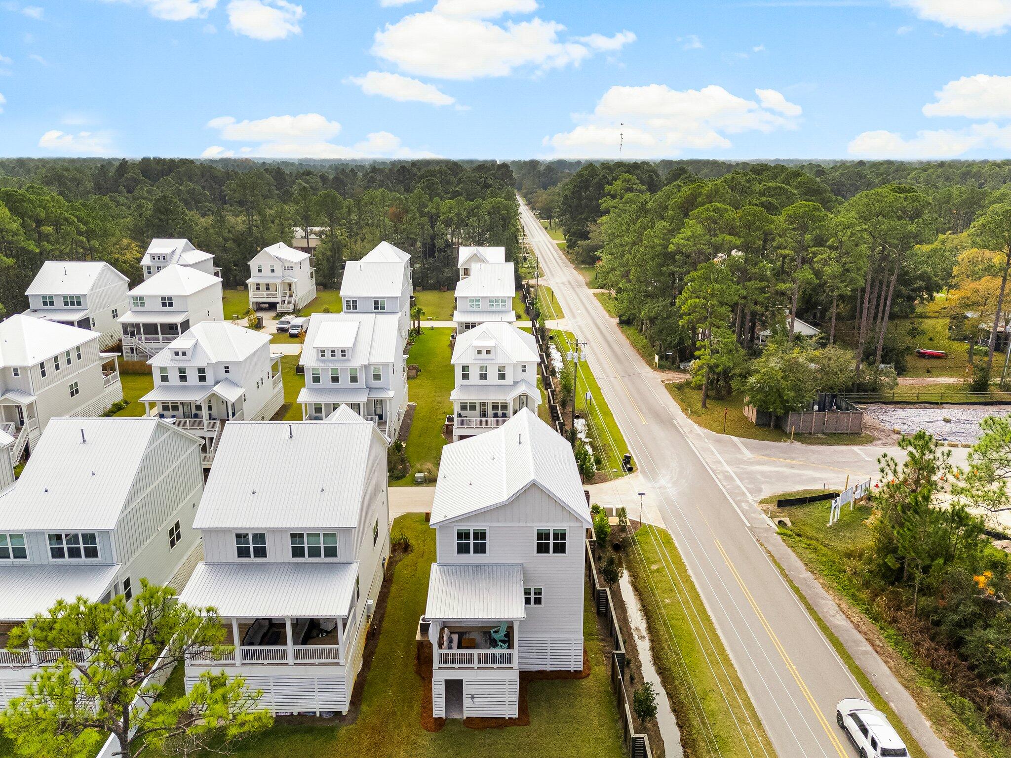 11 Tyler James Way Santa Rosa Beach, FL 32459 - Photo 53 of 56 an aerial view of residential houses with outdoor space and ocean view