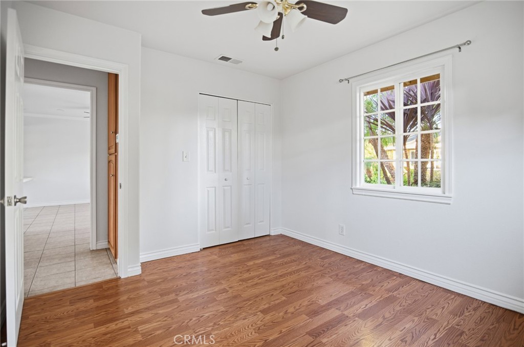 11296 Lampson Avenue Garden Grove, CA 92840 - Photo 15 of 18 a view of empty room with wooden floor and fan