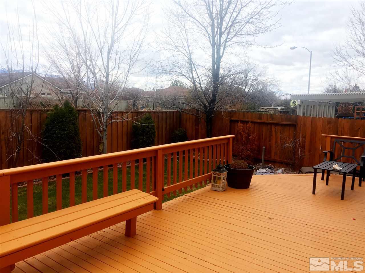 9741 South Legacy Court Reno, NV 89521 - Photo 18 of 19 a view of a wooden deck with furniture