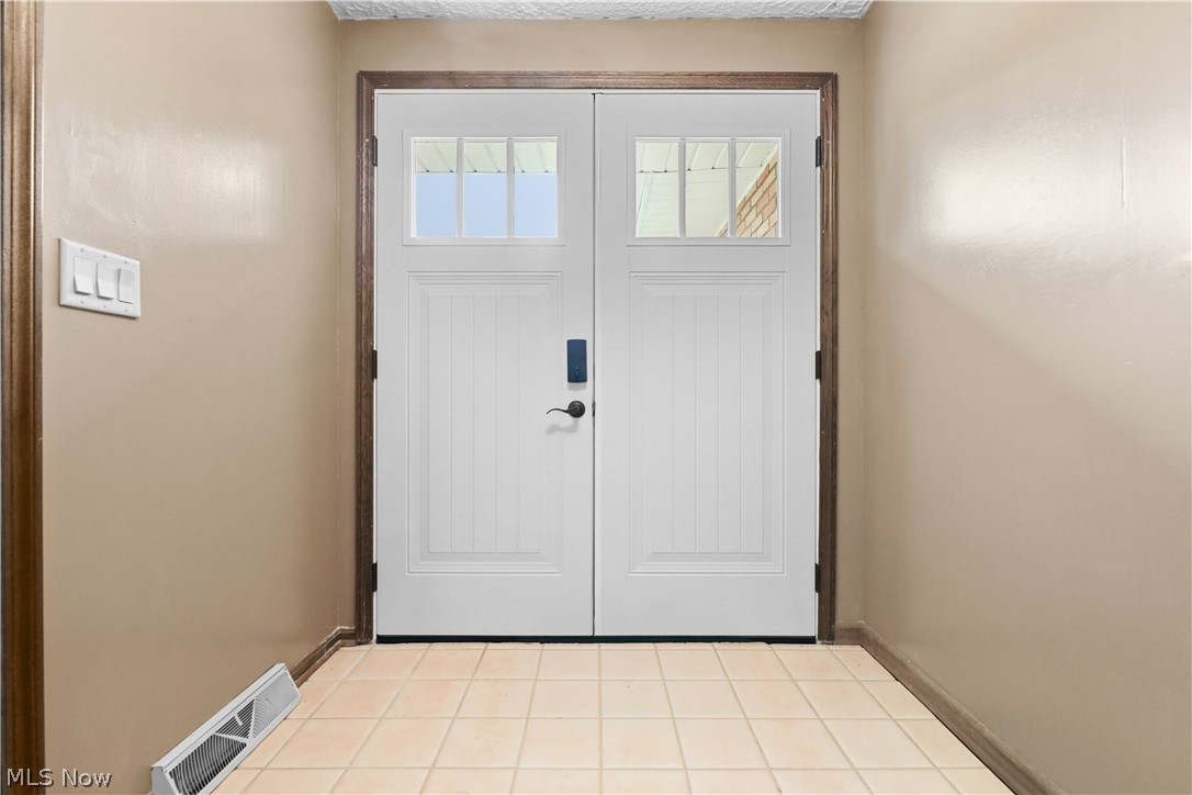 1761 May Road Mogadore, OH 44260 - Photo 2 of 46 Double entry doors with upper window panes and dark hardware