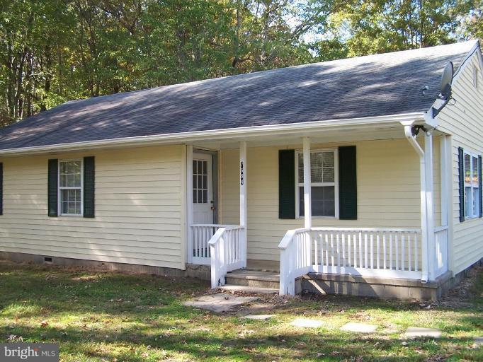 7684 Blueberry Acres Road St. Michaels, MD 21663 - Photo 1 of 1 a front view of a house with a yard