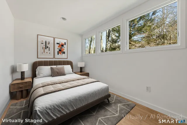 a bathroom with a sink toilet vanity and tub