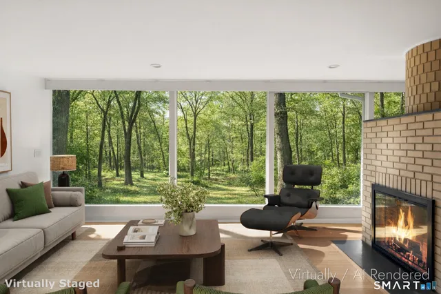 a living room with furniture and large windows