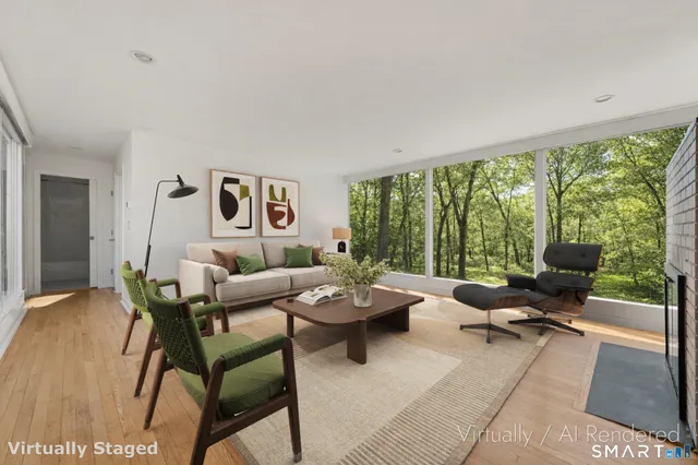 a dining room with furniture and wooden floor
