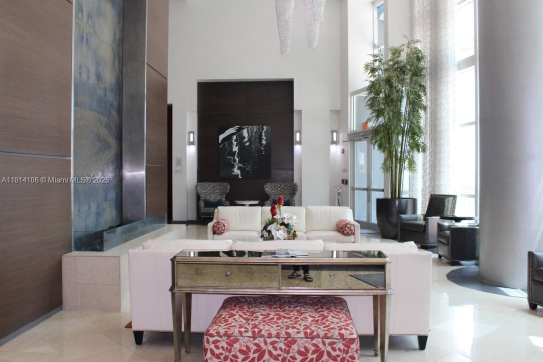 Brickell Miami, FL 33131 - Photo 23 of 25 a living room with furniture and a potted plant