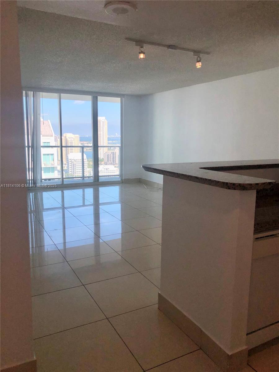 Brickell Miami, FL 33131 - Photo 6 of 25 a view of a livingroom with an empty space and a window