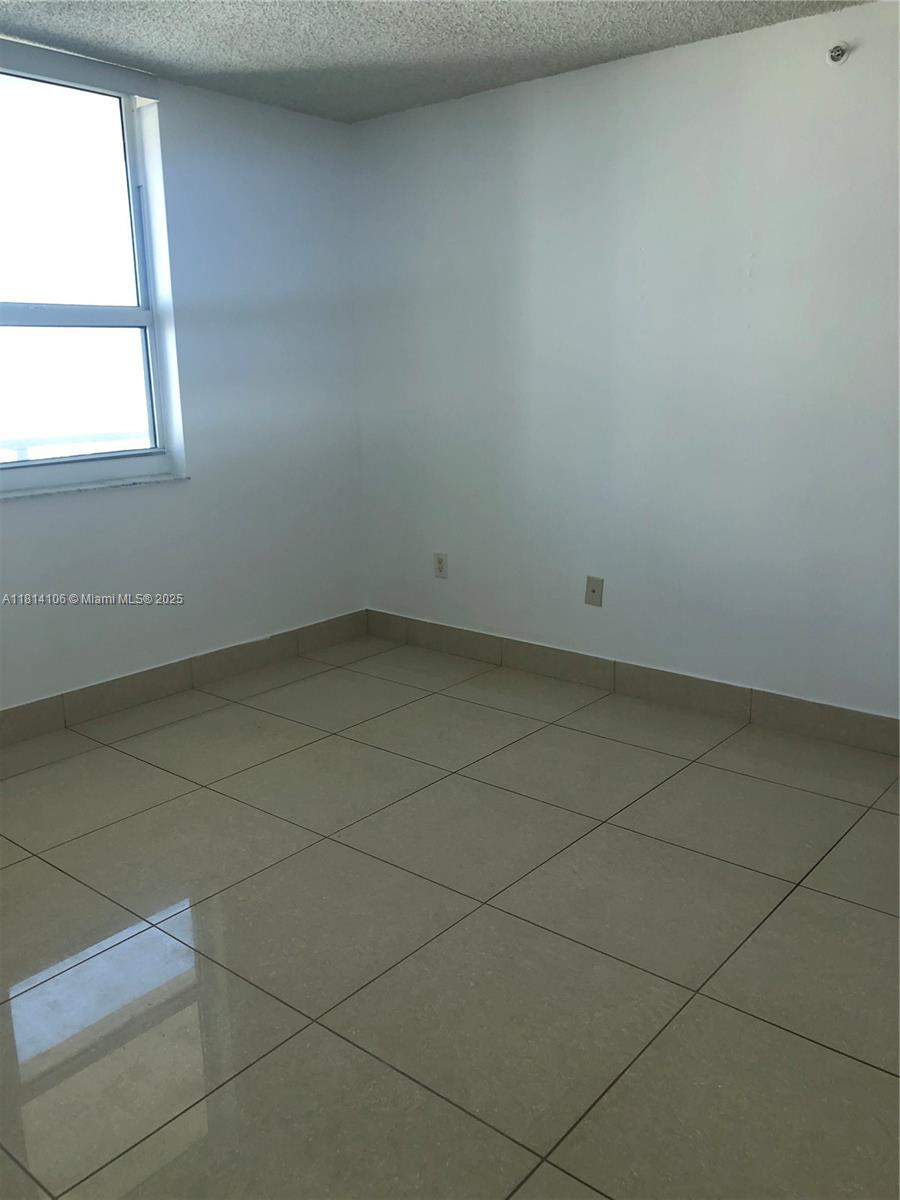 Brickell Miami, FL 33131 - Photo 10 of 25 an empty room with a window