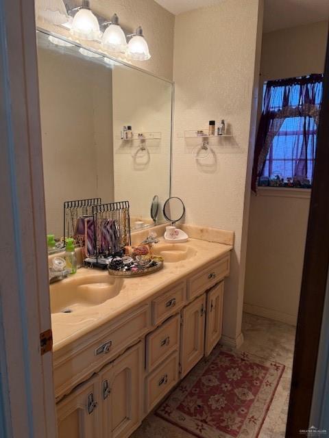 21 East Rios Cove Street Roma, TX 78584 - Photo 11 of 19 a bathroom with a double vanity sink and a mirror