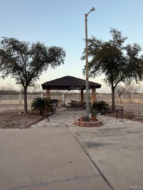 21 East Rios Cove Street Roma, TX 78584 - Photo 17 of 19 a view of a house with backyard and trees