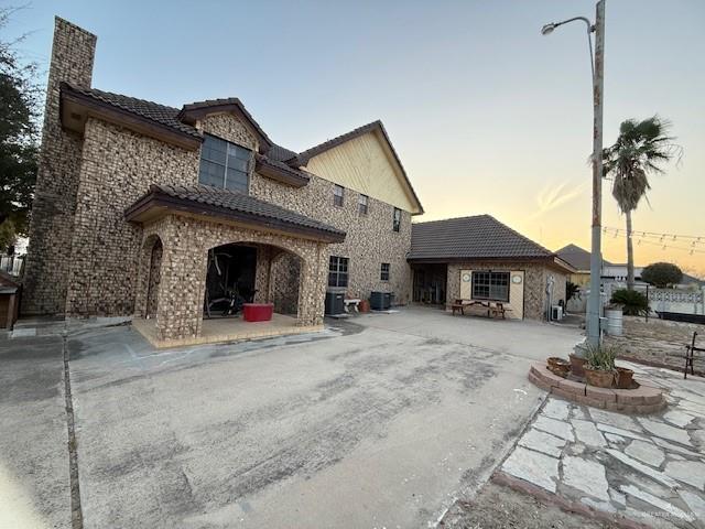 21 East Rios Cove Street Roma, TX 78584 - Photo 19 of 19 a front view of a house with garden
