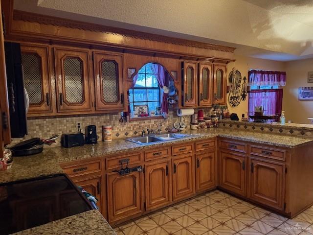 21 East Rios Cove Street Roma, TX 78584 - Photo 2 of 19 a kitchen with stainless steel appliances granite countertop a sink and cabinets