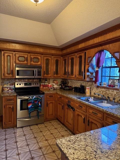 21 East Rios Cove Street Roma, TX 78584 - Photo 3 of 19 a kitchen with stainless steel appliances granite countertop a stove and cabinets