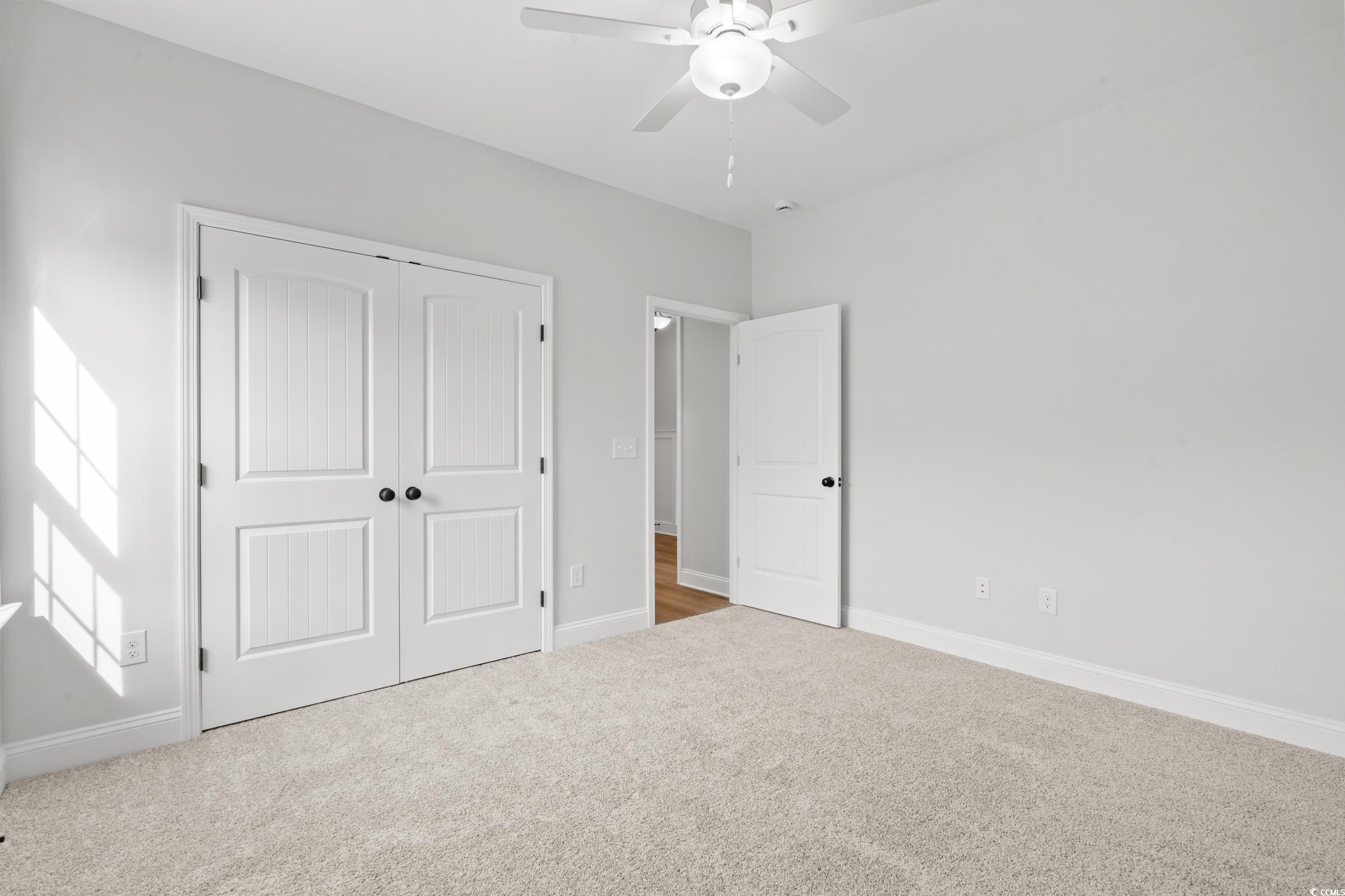 908 Francis Parker Road Georgetown, SC 29440 - Photo 15 of 37 Unfurnished bedroom with carpet floors, a closet, and ceiling fan