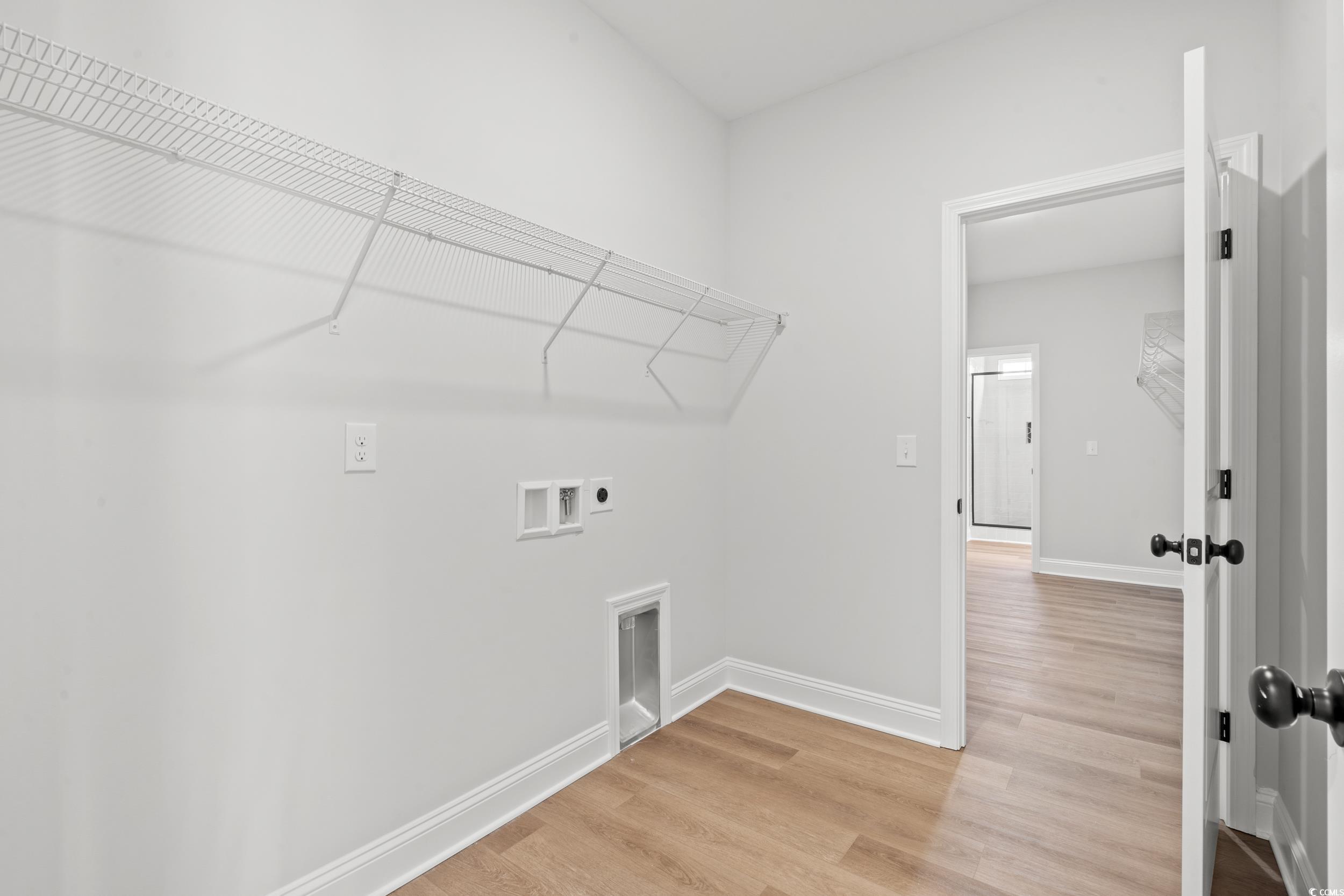 908 Francis Parker Road Georgetown, SC 29440 - Photo 17 of 37 Washroom with light wood-style flooring, hookup for a washing machine, and electric dryer hookup