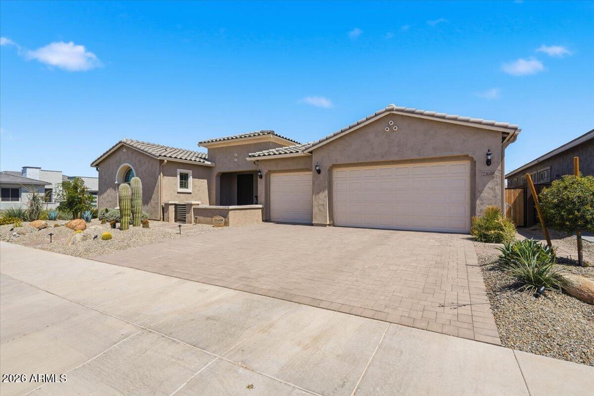 22608 East Stacey Road Queen Creek, AZ 85142 - Photo 44 of 83 a front view of a house with a yard and garage