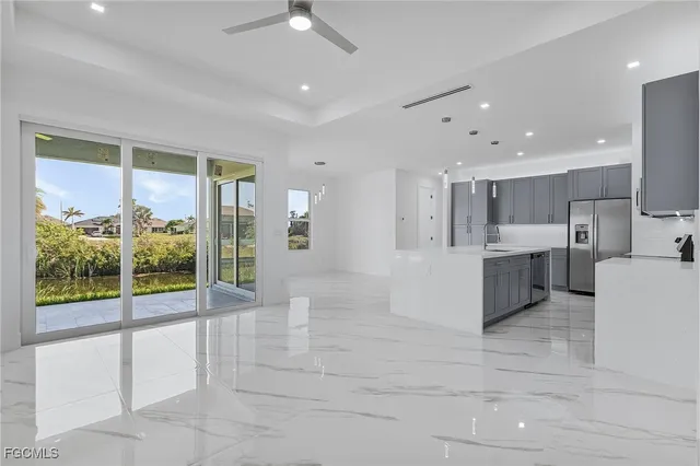a large white kitchen with a large tub and shower