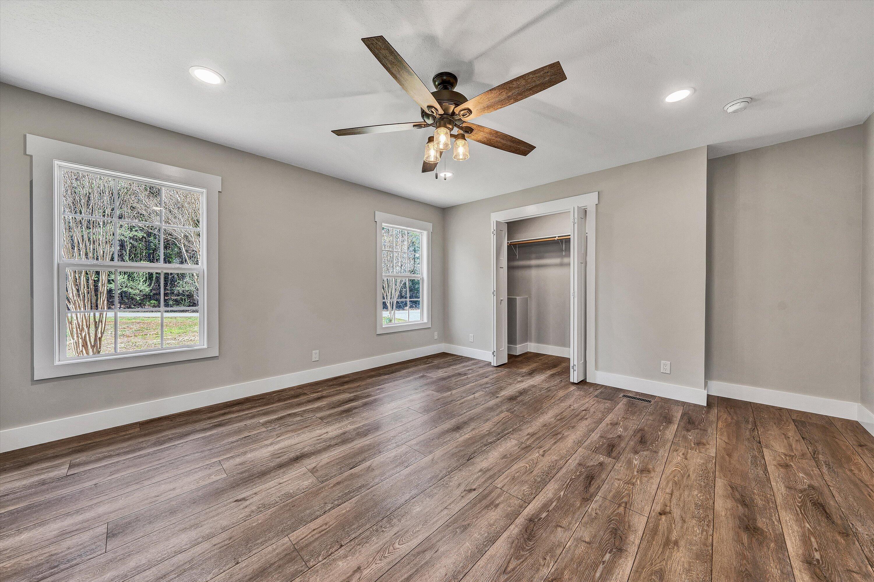 200 Surber Drive Moneta, VA 24121 - Photo 25 of 52 a view of an empty room with wooden floor and a window