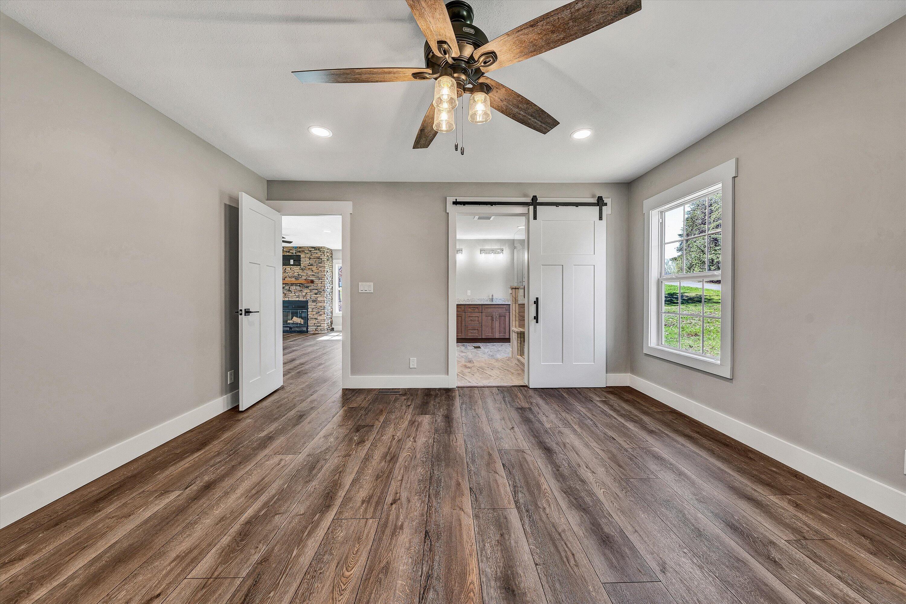200 Surber Drive Moneta, VA 24121 - Photo 26 of 52 a view of an empty room with window and wooden floor