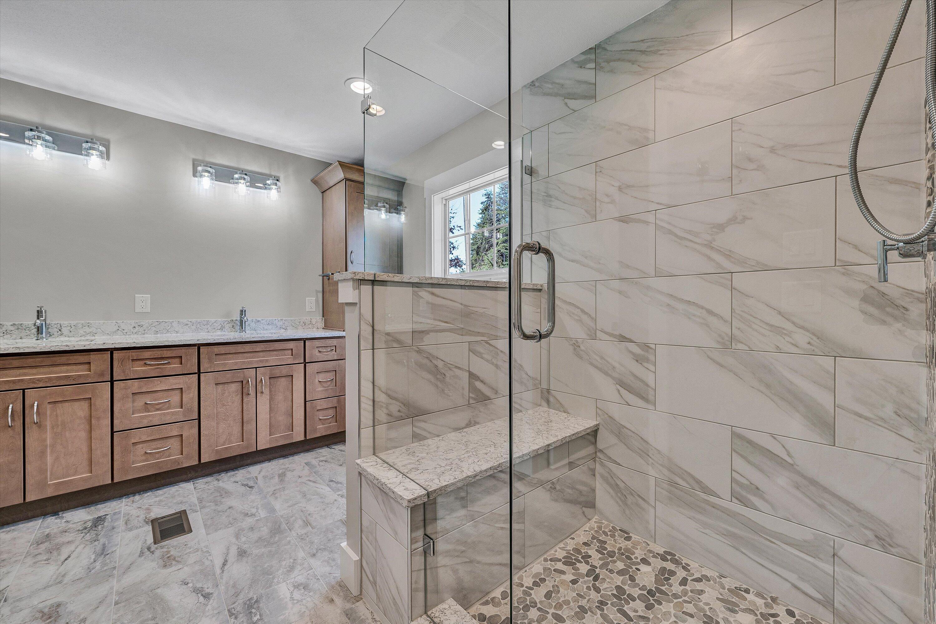 200 Surber Drive Moneta, VA 24121 - Photo 29 of 52 a bathroom with a granite countertop sink a toilet and shower