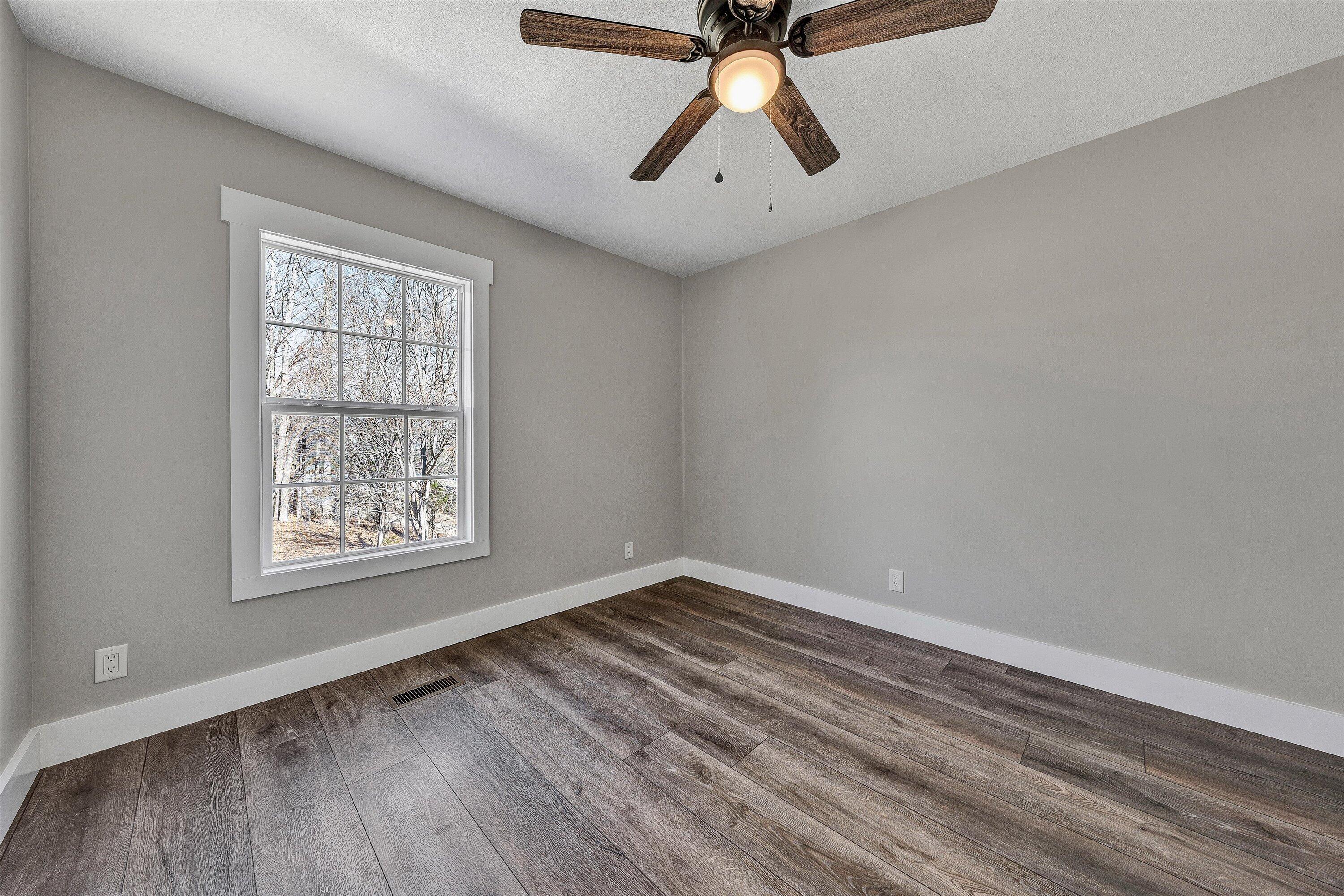 200 Surber Drive Moneta, VA 24121 - Photo 34 of 52 wooden floor in an empty room with a window